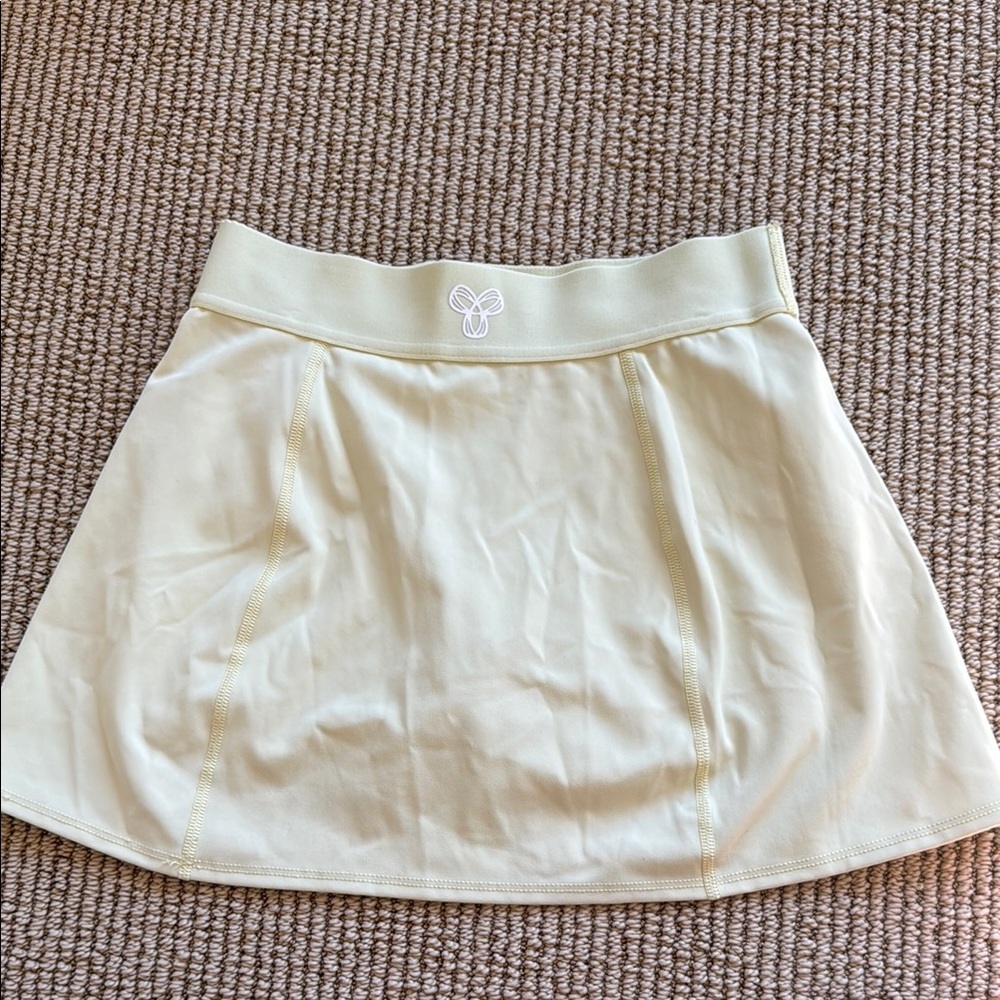 Aritzia TNA light yellow mini skort